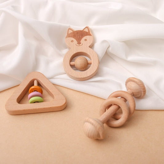 Three wooden rattles, brightly colored designed sensory exploration fine motor skill development. Montessori inspired, safe educational toys easy little ones hold, soft jingle  bells stimulate their senses. newborn baby babies toddler toddlers gift box birthday christmas